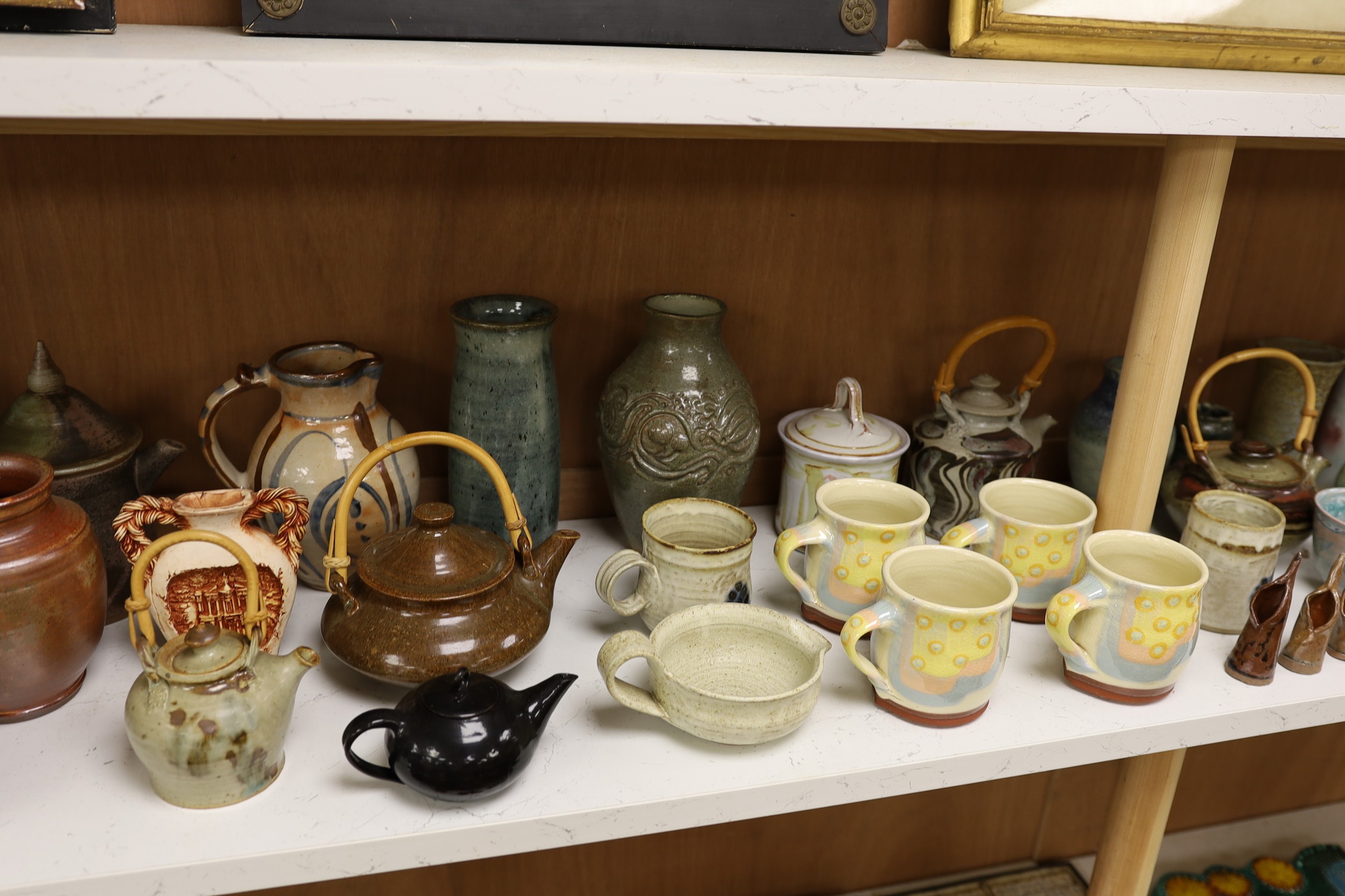 A large quantity of British studio pottery teapots, mugs, jugs and other miscellaneous items, to include a vast amount by Susan Threadgold